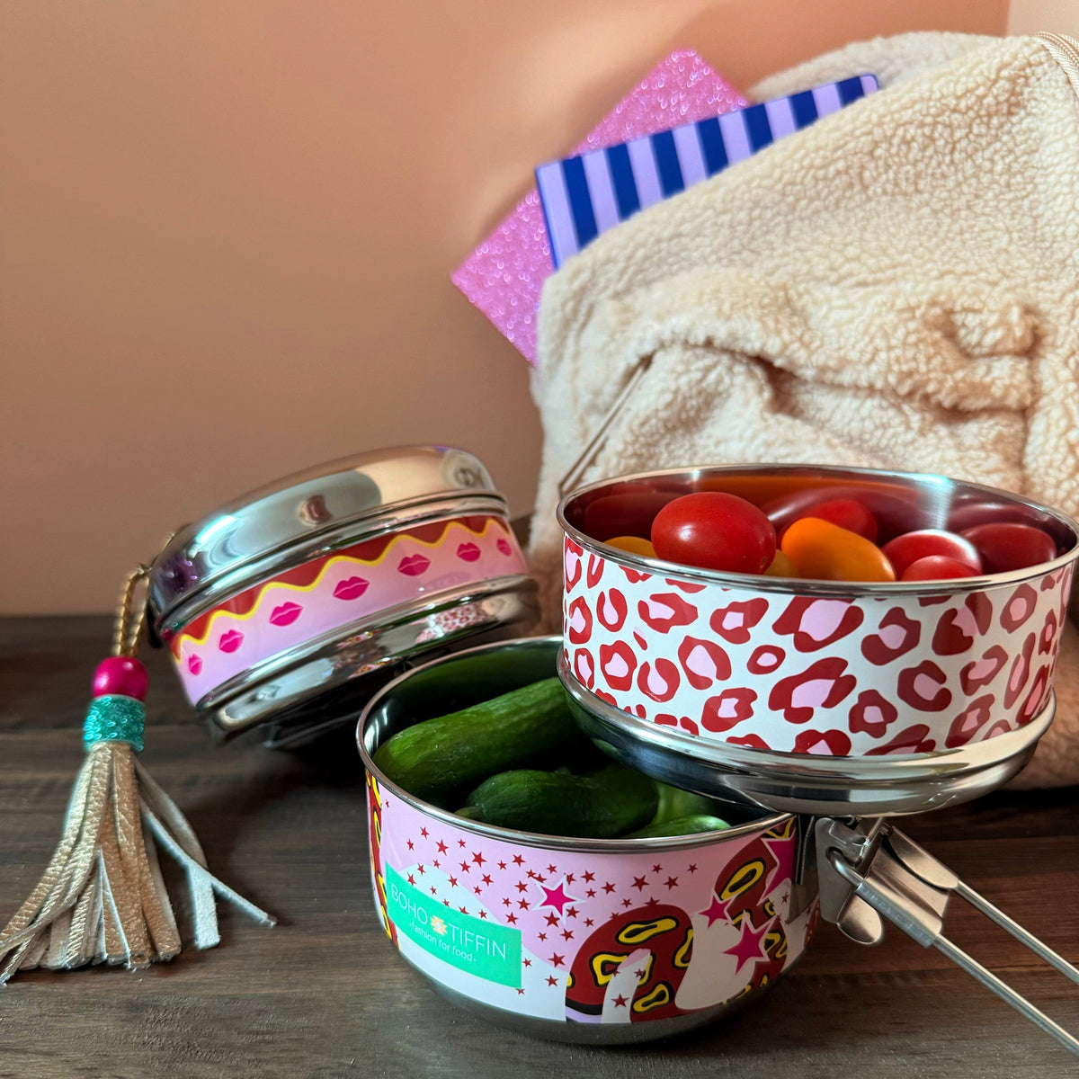 Boho-Tiffin stainless steel 3-in-1 lunchbox with leopard, lip, and snake print, filled with fresh vegetables.