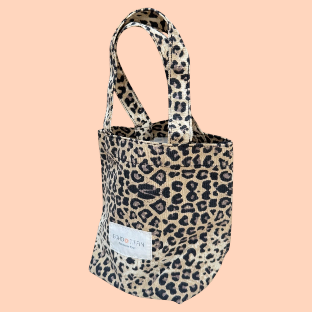 Boho-Tiffin leopard print canvas tote bag with dual handles and a branded white fabric label on the front.