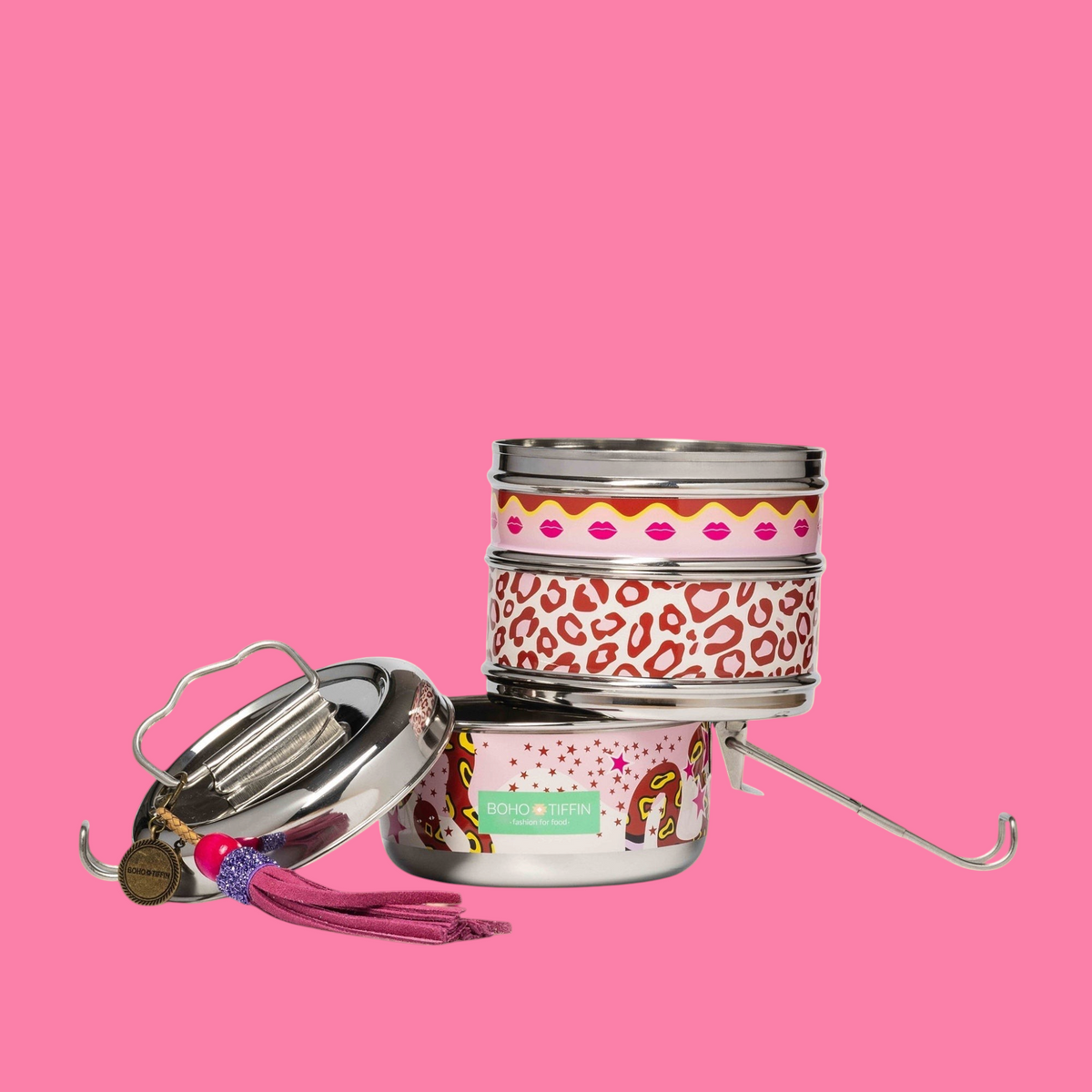 Boho-Tiffin stainless steel 3-in-1 lunchbox with pink leopard, lip, and snake print, featuring a decorative tassel.