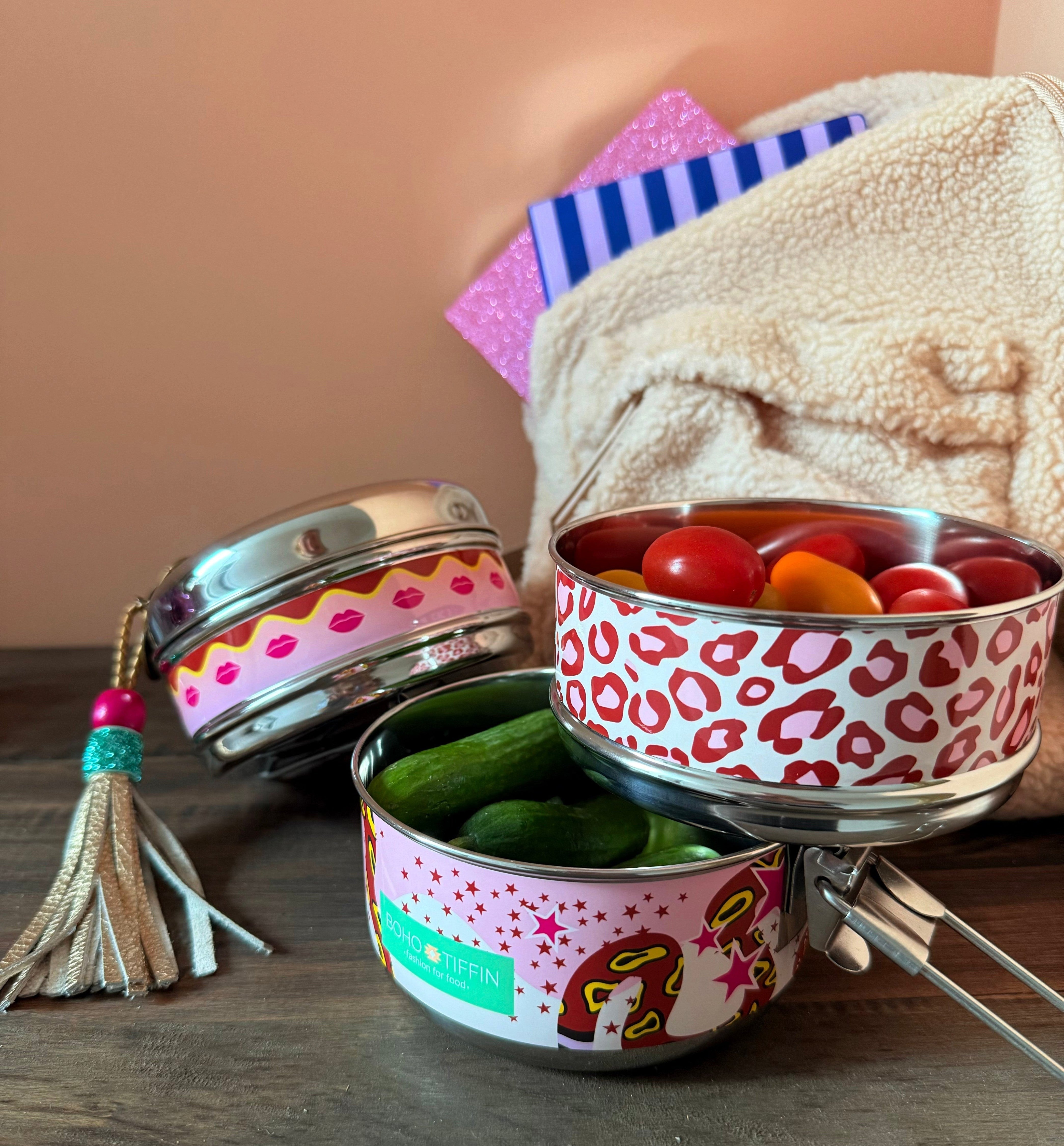 Boho-Tiffin stainless steel 3-in-1 lunchbox with leopard, lip, and snake print, filled with fresh vegetables.