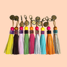 Boho-Tiffin collection of colorful leather tassels with wooden beads and metallic charms for bags and accessories