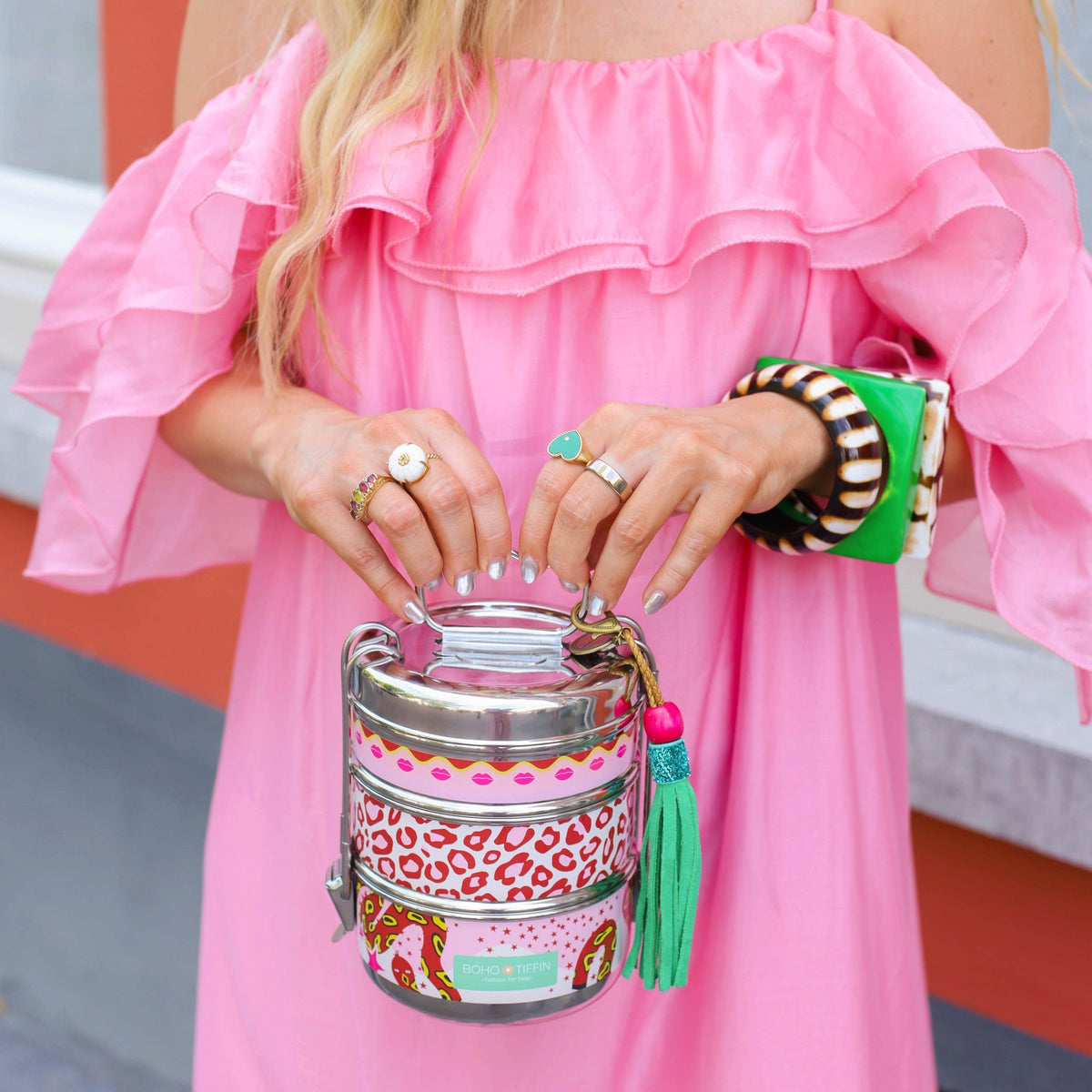 Boho-Tiffin Kiss and Snake stainless steel 3-tier lunchbox with leopard, lip, and snake print held by a woman
